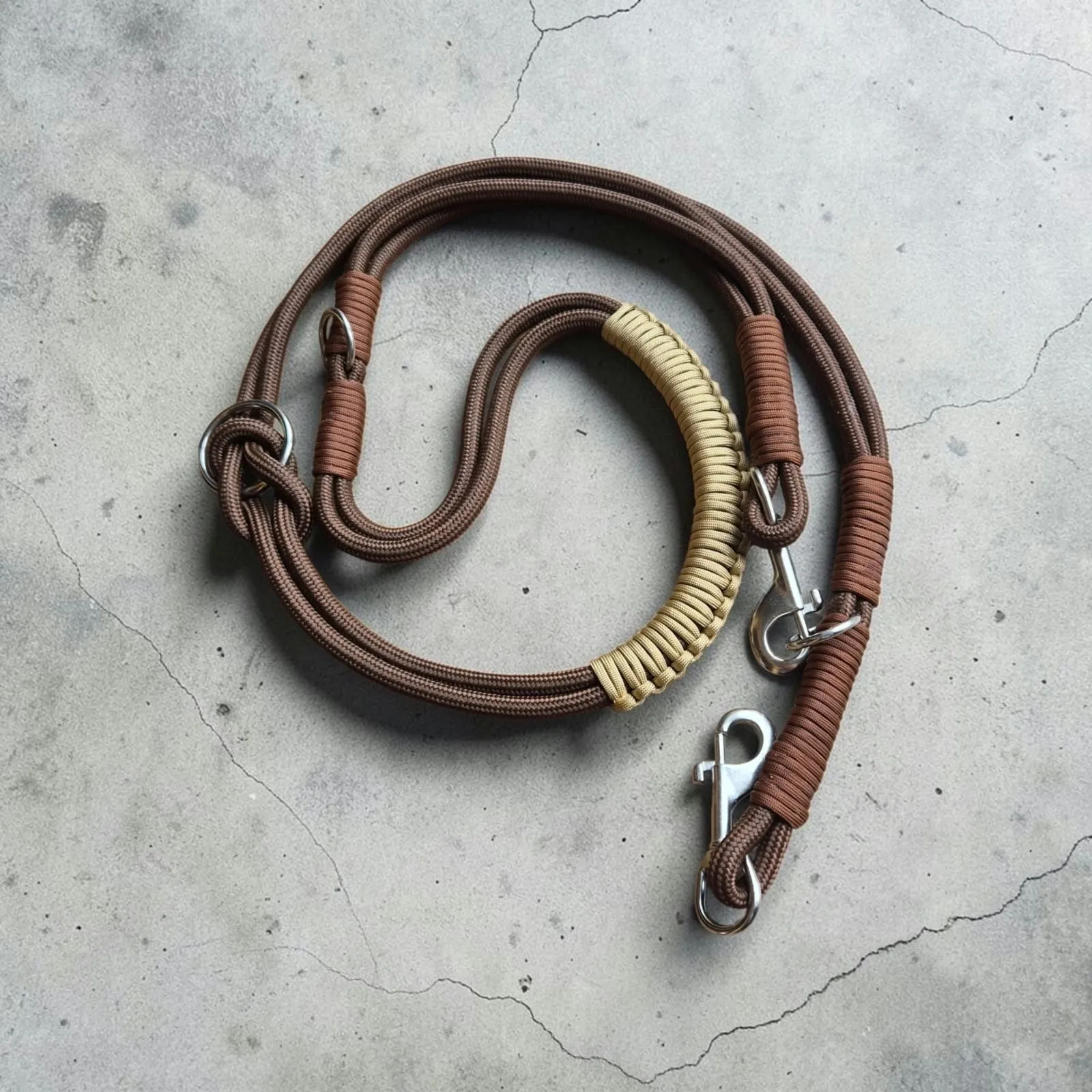 Coiled brown rope lead with stainless steel clips