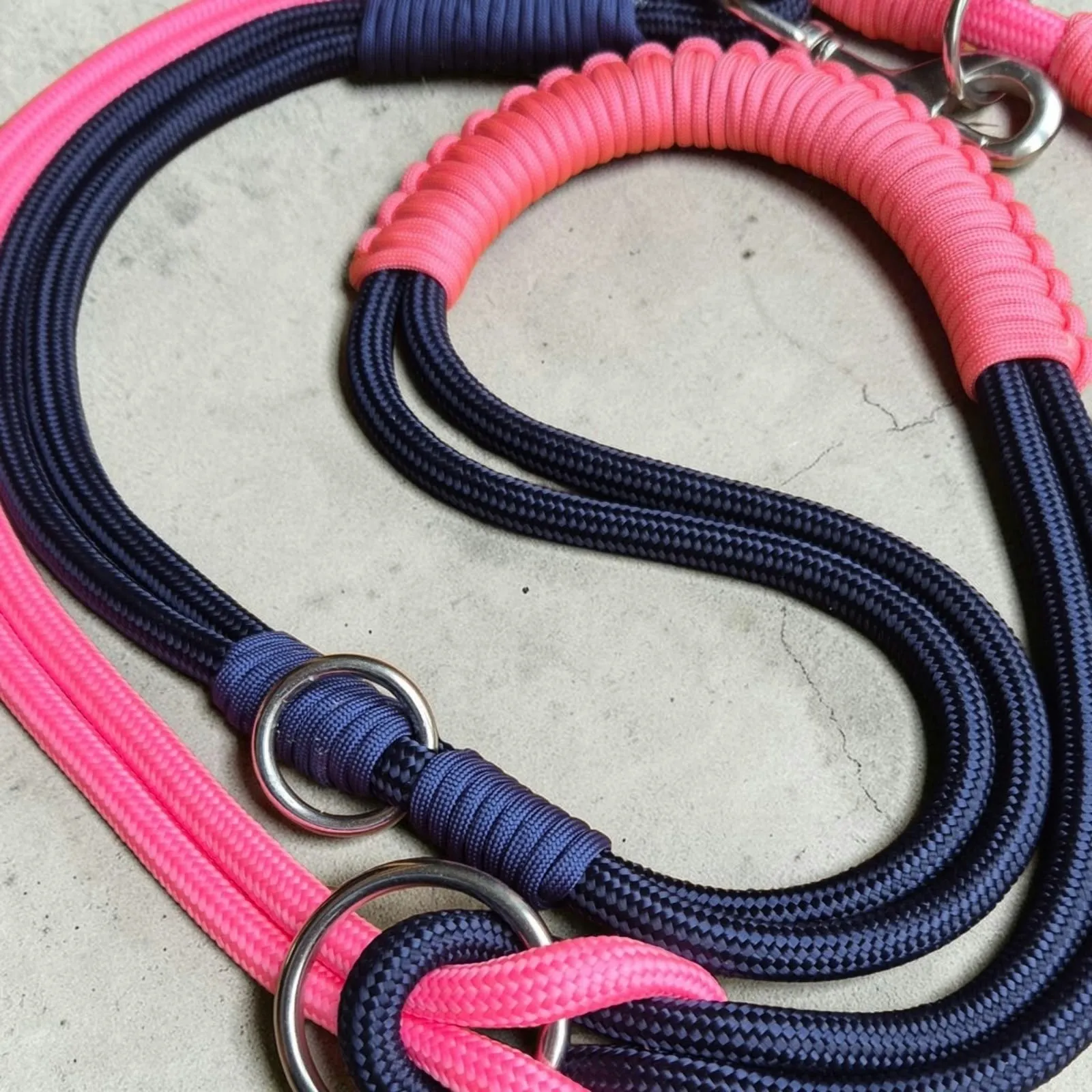 Close-up of navy and neon pink rope lead with stainless steel rings