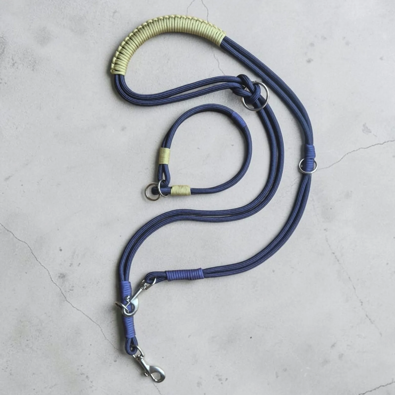 Navy rope lead with stainless steel trigger clips and a beige braided handle